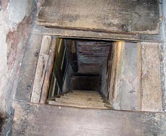 Priest hole in the cupboard of Harvington Hall, Worcestershire