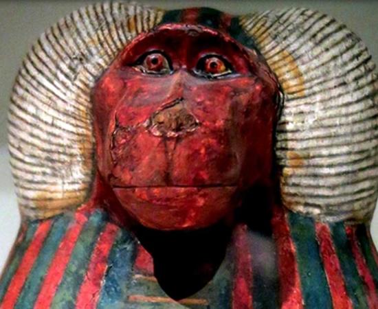 Detail from one of the canopic jars of Padiouf, a priest of Amun, shows the face of the god Hapy; design by Anand Balaj