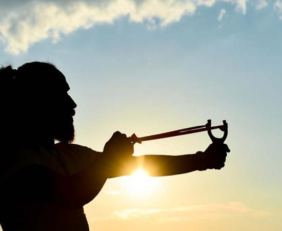 Representational image of man with slingshot. Source: emerald_media / Adobe Stock