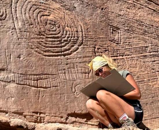 Researcher records pueblo culture petroglyphs found high in Mesa Verde.	Source: Jangiellonian University