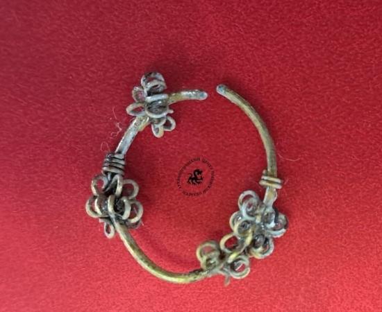 Rare Balkan-style silver temple ring excavated at the Olginsky-10 site in Pskov, Russia