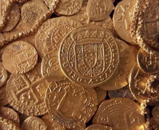 The "Tricentennial Royal" coin pictured here was die-cast, unlike most coins minted in the Spanish colonies during the 1700s. 