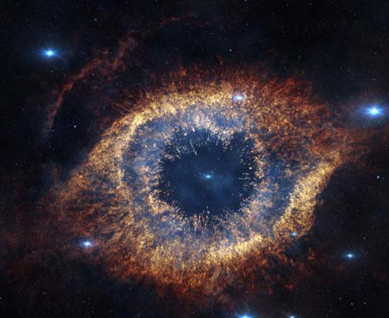ESO's Visible and Infrared Survey Telescope for Astronomy (VISTA) has captured this unusual view of the Helix Nebula (NGC 7293), a planetary nebula located 700 light-years away. The Helix Nebula is sometimes called the “Eye of God.”