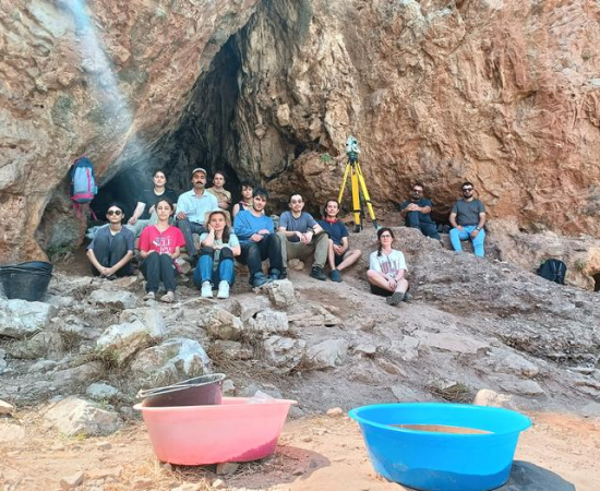 Researchers excavate Üçağızlı II Cave in southern Turkey during the 2024 field season. Artifacts recovered from the cave have provided evidence that Neanderthals and early Homo sapiens may have shared technological traditions and cultural practices for thousands of years.