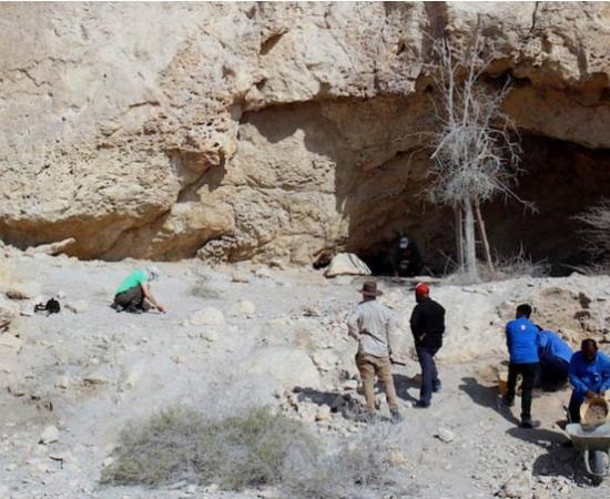 Researchers at Jabal Kaf Addor rock shelter in the Al Habhab region, UAE.  	Source: Fujairah Tourism & Antiquities Authority