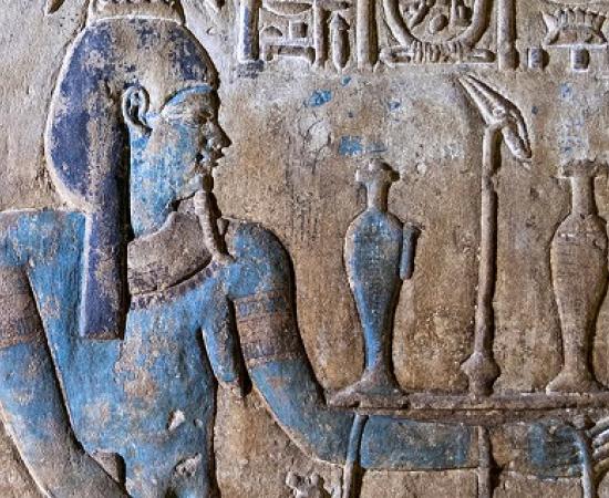 Example of the colorful paintings after the restoration: Nile god with further painted details (jewelry, pupil) and flowers painted on the offering tray. 