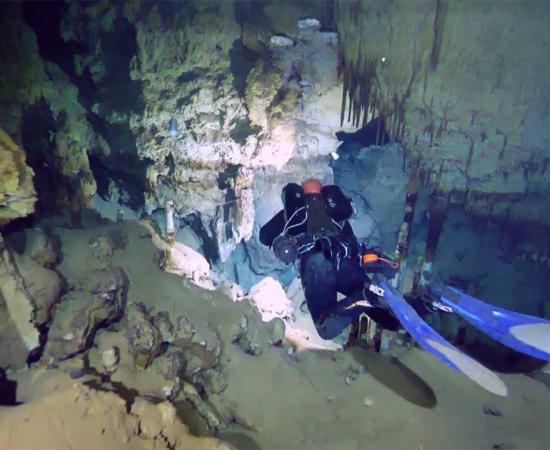 Divers exploring the underwater caves where the amphorae were found. (SONARS / Facebook)