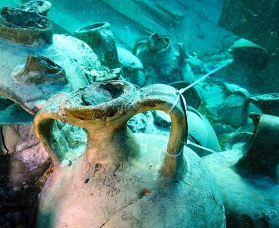 The Roman inscription is still clear on this amphorae recovered with many other well-preserved artifacts from a 4th-century-AD Roman cargo ship found meters from a busy Mallorca, Spain beach in 2019.					Source: Jose A Moya / Arqueomallornauta-Consell de Mallorca, Universitat de Barcelona, Universidad de Cádiz, Universitat de les Illes Balears