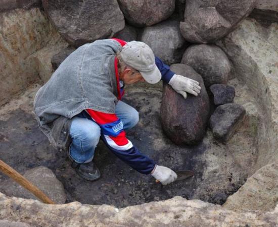 An archaeologist at work in a Roman-era necropolis in Poland 