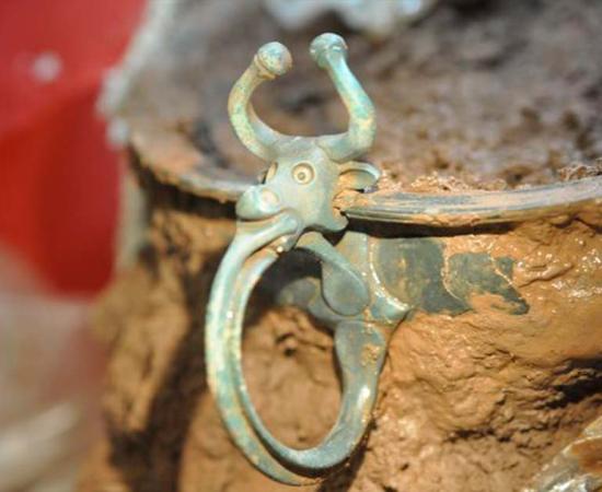 Iron Age copper alloy bowl with an ox head handle was one of the items found in Wales. Source: National Museum Wales