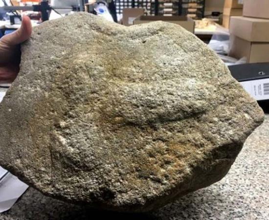 The millstone with an ancient Roman phallus engraving. Source: Highways England