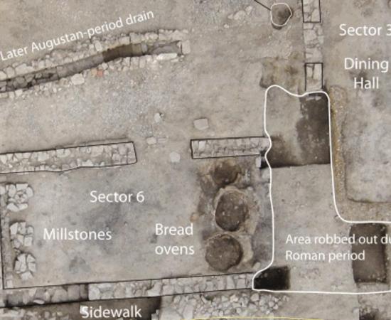 Site of the 2,100-year old Roman tavern, featuring the pits of taboon ovens for bread, a huge dining section to the right, a drainage system and millstones.