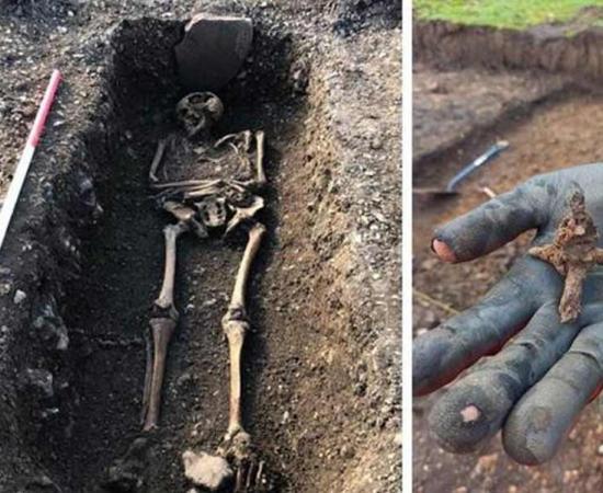 English archaeologists have stumble upon a once-in-a-lifetime Romano-British settlement near Bishop’s Stortford, Hertfordshire. This skeleton and a caltrop, a Roman era area denial weapon, similar to police spikes used to stop cars today, were unearthed at the Grange Paddocks site.		Source: East Herts District Council