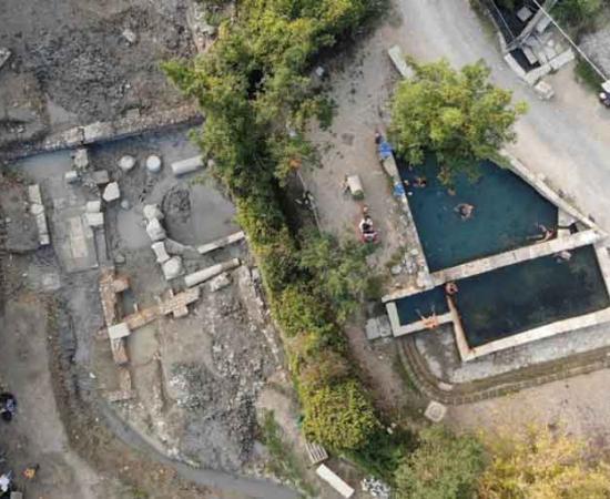 The San Casciano dei Bagni ancient Roman bath site (left), next to the modern baths.