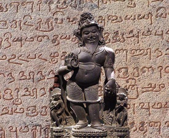 Agastyar, Father and Chairman of first Tamil Sangams, Madurai, Pandiya Kingdom. (CC BY SA 2.5) Detail of ancient Tamil script found on the temple walls of the Tanjore Bragadeeshwara temple. 