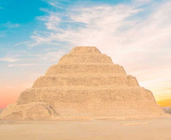 The Pyramid of Djoser looms above the desert landscape in Saqqara necropolis, ancient burial ground of the elite. Source: marinadatsenko / Adobe Stock