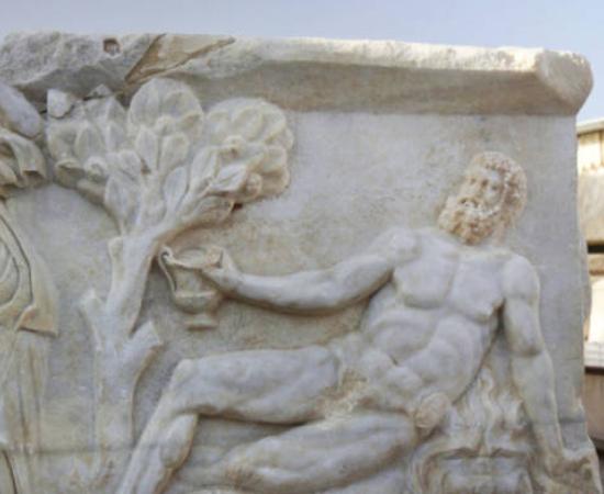 Hercules is represented on the sarcophagus here, reclining in a chair, holding a cup, but no longer able to stand.