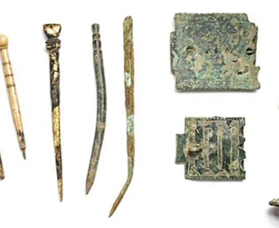 Scholarly tools from left: quills, styluses and book clasps.