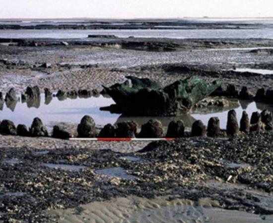 Seahenge timber enclosure with central inverted oak stump, thought to be used for rituals intended to influence the climate.