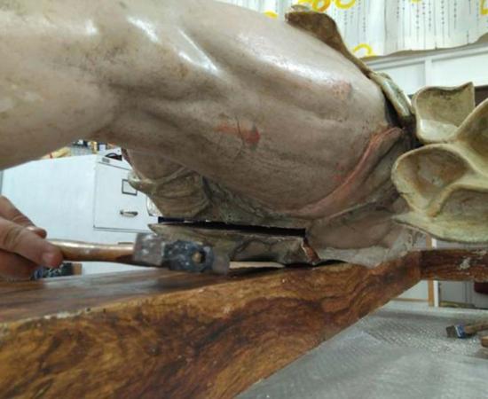 The document was found hidden under the wooden loin cloth of the statue