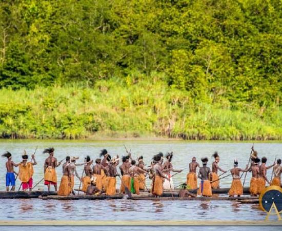 Men of the Asmat tribe are floating in a canoe on the river. Amanamkay. Village, Asmat province, Indonesia (gudkovandrey/ Adobe Stock)