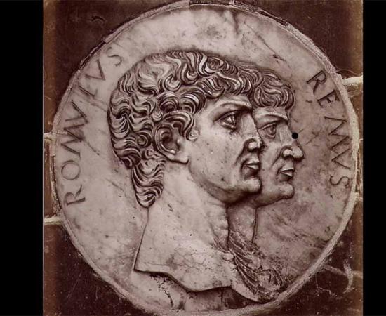 "Certosa di Pavia - Medallion at the base of the facade". The Latin inscription tells that these are Romulus and Remus.           Source: Public Domain