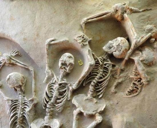 Some of the shackled skeletons found in a mass grave near Athens, Greece