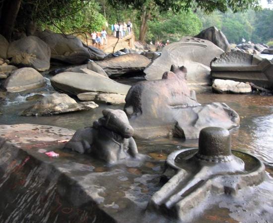 The riverbed rock carvings also show Nandi, Shiva’s bull mount. The lingam in this photo is the protuberance, and the figure that encircles it is the yoni, or feminine symbol.