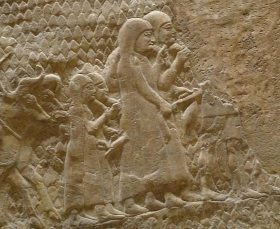 ‘Siege of Lachish’. Credit: The British Museum; photo by C. Reeder. This relief from Sennacherib’s palace in Nineveh celebrates the Assyrian destruction of the Judaean city of Lachish. Women and children, followed by a man driving oxen, flee from the besieged city.