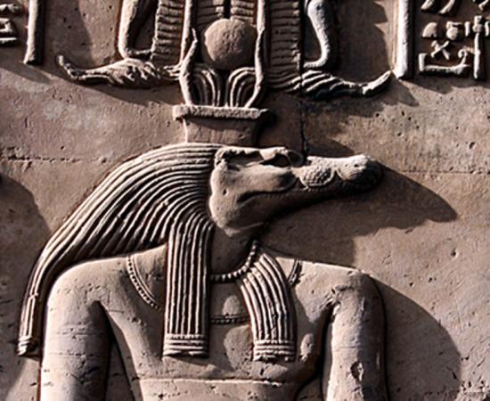 Close up of Sobek as represented on a relief from the Temple of Kom Ombo shows Sobek with typical attributes of kingship, including a was-scepter and royal kilt.  