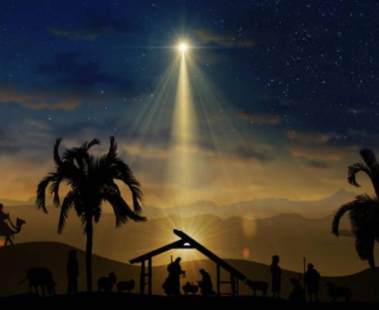 The Star of Bethlehem shining over the nativity stable scene.