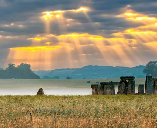 View of Stonehenge landscape at sunrise. Source: valeryegorov / Adobe Stock 