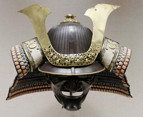 Japanese parade helmet, made from iron, gilded copper, lacquered leather, silk