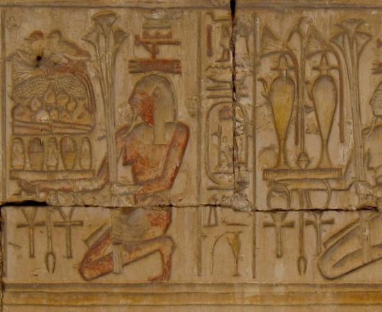 Sunk relief of personified provinces of Egypt bearing offerings for the temple god. Temple of Ramesses II at Abydos. 