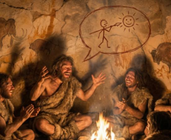 Early humans in a cave enjoying a humorous story.