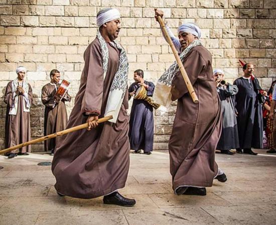 Tahtib dance or ancient Egyptian martial art stick fighting being performed in modern Egypt.	Source: Traditional Sports