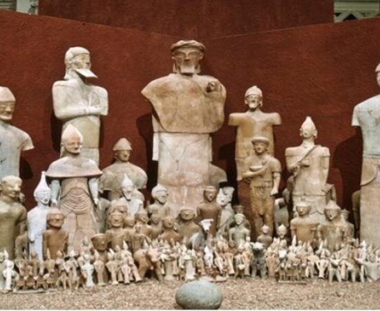 Photograph from one of the Cyprus Exhibitions at Medelhavsmuseet with the terracotta sculptures and the betyl (stone) from Agia Eirini.	
