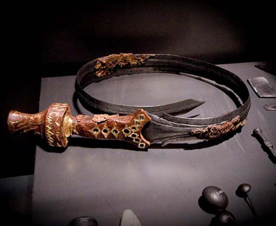 A beautifully decorated bent sword, 826-600 BC, part of the finds in a noble's grave at Oss in The Netherlands.