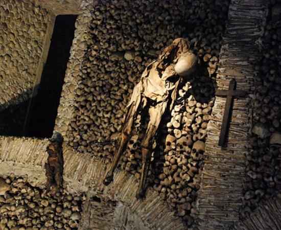 Dried corpse hanging on the wall in the chapel at Évora