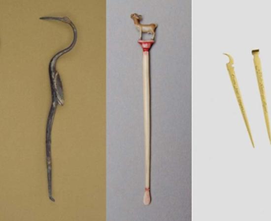 Romano-British silver toothpick. (The British Museum) An ivory toothpick found in India. (The British Museum) A gold case with matching a tooth and earpicks.