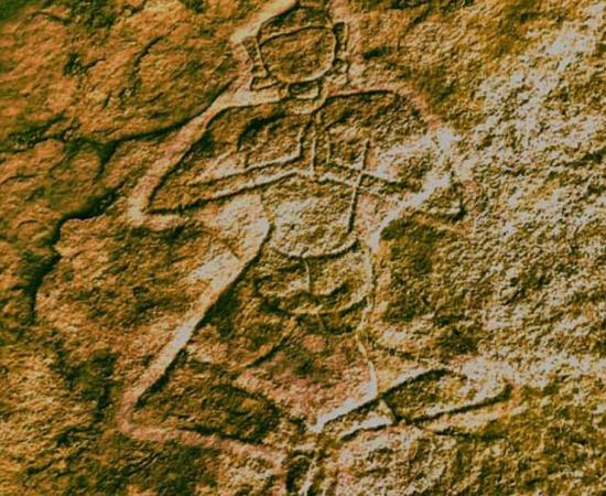 The yogi above the altar was found carved into a rock surface of Kudakumalai Cave near Pudukottai. 