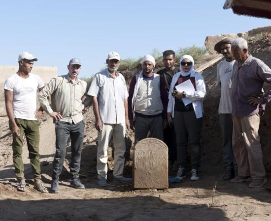 The Tiberius stele found at Karnak with some of the researchers on the project.