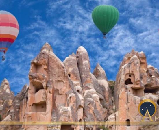 Colorful hot air balloons flying over Red valley in Cappadocia, Anatolia, Turkey (Svetlana Nikolaeva/ Adobe Stock)