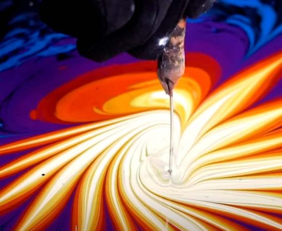 Turkish artist Garip Ay producing ebru water art. Source: YouTube Screenshot / Great Big Story)
