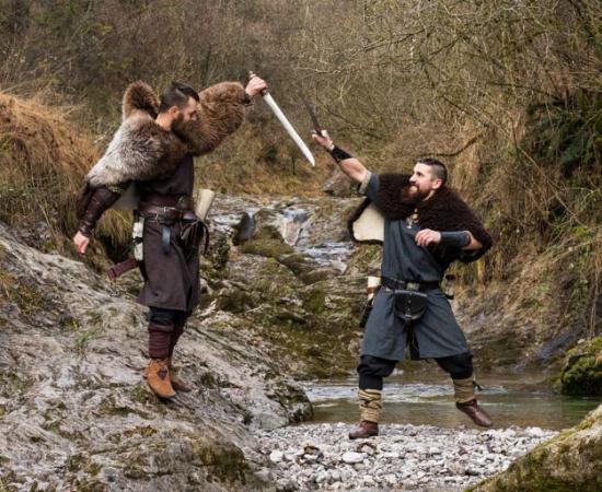 Two Viking re-enactors fighting
