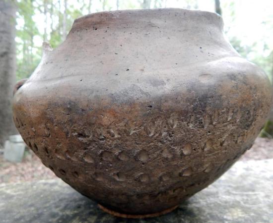 Bronze Age pot of the proto-Celtic Urnfield culture, sporting ritualistic symbols and mathematical markings. 