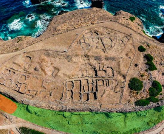 The Middle Bronze Age “Faraglioni” village at Ustica and the long and arched defensive wall.	Source: Drone photo by V. Ambrosanio, 2022/Science Direct