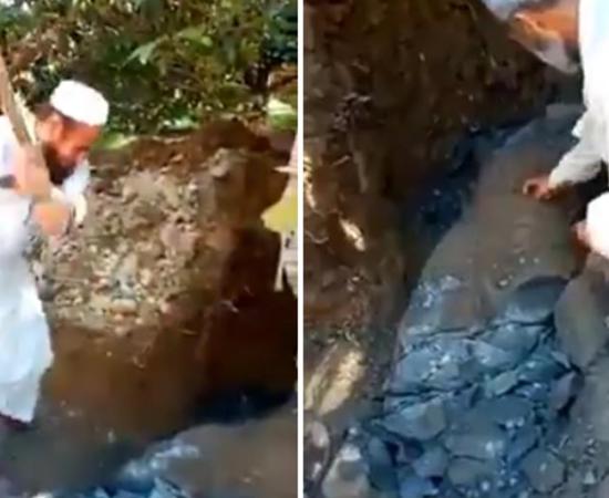 Screengrab from video showing vandals in Pakistan destroying Buddhist statue