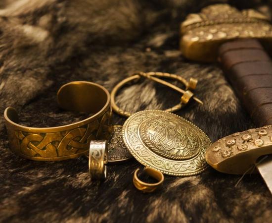 Viking jewelry and sword representations on fur