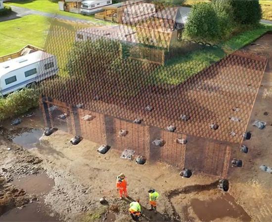 The site of the newly discovered rare ancient Viking temple found in Norway with an imagined reconstruction of the actual building.   Source: University Museum of Bergen